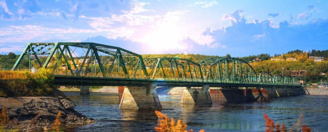 Old Saguenay Bridge and River - Stock Photo